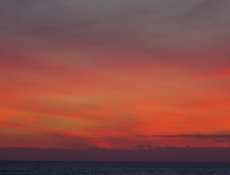 Photo of sunset showing reds, oranges and yellows