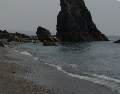 Photograph of a constructive wave rolling up a beach